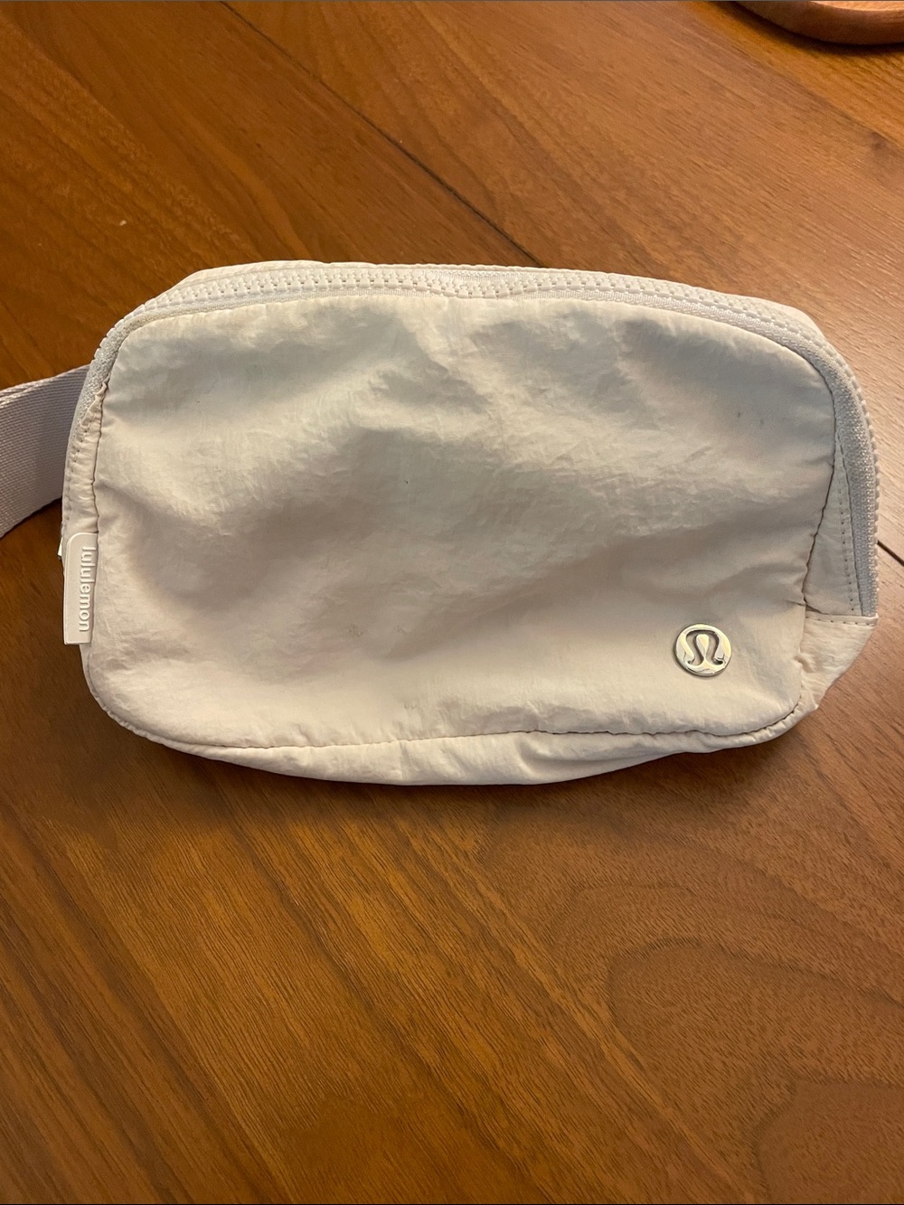 lululemon Everywhere Belt Bag with long adjustable strap in ivory.
